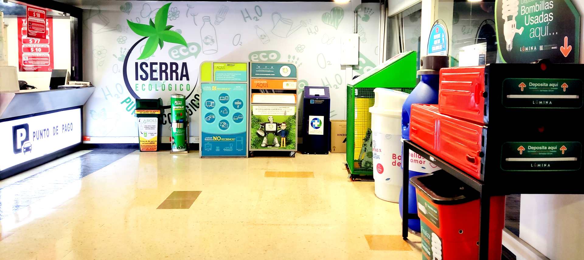 Corredor del punto ecológico de Iserra 100 con los puntos de recolección